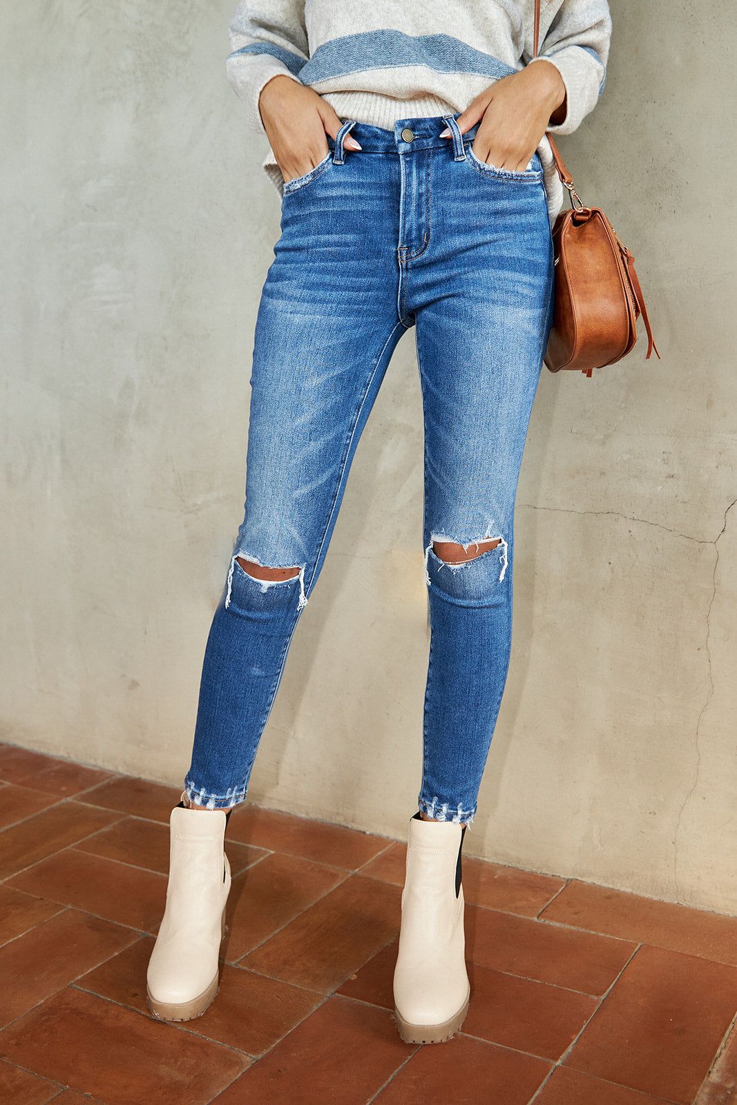 Torin Mid Rise Distressed Skinny Jean